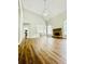 Spacious living room with hardwood floors, fireplace and kitchen view at 306 Mountain Laurel Walk, Canton, GA 30114