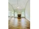 Open-concept living room with fireplace, hardwood floors, and lots of natural light at 306 Mountain Laurel Walk, Canton, GA 30114