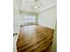 A spacious main bedroom features wood-look flooring and a ceiling fan at 306 Mountain Laurel Walk, Canton, GA 30114