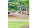 Community playground featuring slides, climbing structures, and shaded seating areas for Gathering fun at 306 Mountain Laurel Walk, Canton, GA 30114