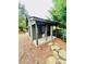 Charming outdoor playhouse with a covered porch, perfect for ' imaginative play at 306 Mountain Laurel Walk, Canton, GA 30114