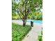 Spacious community pool area with a lifeguard stand, partially covered for shade and sun at 306 Mountain Laurel Walk, Canton, GA 30114