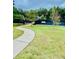 Well-maintained tennis courts surrounded by a lush lawn and greenery, perfect for active residents at 306 Mountain Laurel Walk, Canton, GA 30114