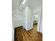 A walk-in closet includes built-in shelving and wood floors at 306 Mountain Laurel Walk, Canton, GA 30114
