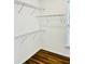 A walk-in closet offers built-in wire shelving and wood flooring at 306 Mountain Laurel Walk, Canton, GA 30114