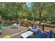 An elevated deck view of the backyard, complete with outdoor furniture for relaxing and entertaining at 294 Puckett Se Rd, Emerson, GA 30137