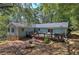 Back of the house showcasing a spacious deck overlooking a lush yard, perfect for entertaining and relaxation at 294 Puckett Se Rd, Emerson, GA 30137
