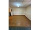Open basement area with wood-look flooring, neutral paint and ample space for furniture at 294 Puckett Se Rd, Emerson, GA 30137