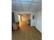 Open basement area with wood-look flooring, neutral paint with access to the kitchen at 294 Puckett Se Rd, Emerson, GA 30137