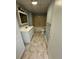 Bathroom featuring a jetted tub with a shower, tiled flooring, vanity, and updated fixtures at 294 Puckett Se Rd, Emerson, GA 30137