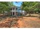 Two story exterior of home featuring a front porch on both levels with stone and blue siding at 294 Puckett Se Rd, Emerson, GA 30137