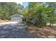 Quaint home with a two-car garage and a well-maintained yard, surrounded by mature trees at 294 Puckett Se Rd, Emerson, GA 30137