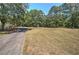 Expansive front yard with a long driveway, leading to a hidden home at 294 Puckett Se Rd, Emerson, GA 30137