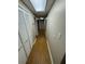 Well-lit hallway featuring wood laminate flooring and multiple closets for ample storage space at 294 Puckett Se Rd, Emerson, GA 30137