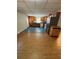 The kitchen flows seamlessly to the den, featuring oak cabinets and stainless steel refrigerator at 294 Puckett Se Rd, Emerson, GA 30137