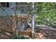 Cozy ground level porch area with stone accents, offering a charming spot to unwind and enjoy the outdoors at 294 Puckett Se Rd, Emerson, GA 30137