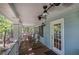 Cozy covered porch featuring rocking chairs, a ceiling fan, and a door with glass panes at 294 Puckett Se Rd, Emerson, GA 30137