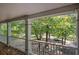 Charming covered porch with white railings, perfect for enjoying the natural scenery and outdoor relaxation at 294 Puckett Se Rd, Emerson, GA 30137