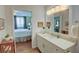 Bathroom with vanity, large mirror and bedroom view at 300 Johnson Ferry Ne Rd # B1003, Sandy Springs, GA 30328