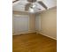 Spacious bedroom with hardwood floors and large windows at 6922 Magnolia Park Dr, Norcross, GA 30093