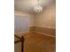 Elegant dining room featuring hardwood floors and a chandelier at 6922 Magnolia Park Dr, Norcross, GA 30093