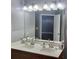 Bathroom featuring a double sink vanity with designer lighting, and decor at 898 Oak Sw St # 3108, Atlanta, GA 30310