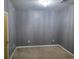 A secondary bedroom with neutral colored walls and carpet plus overhead lighting at 898 Oak Sw St # 3108, Atlanta, GA 30310