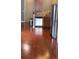 Open kitchen with stainless steel appliances, wood cabinetry, granite countertops, and hardwood floors at 898 Oak Sw St # 3108, Atlanta, GA 30310