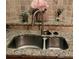 Granite countertops surround the stainless steel kitchen sink with stone tile backsplash at 898 Oak Sw St # 3108, Atlanta, GA 30310