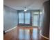 The naturally lit living room offers hardwood floors, a ceiling fan, and double windows with flowing sheer curtains at 898 Oak Sw St # 3108, Atlanta, GA 30310