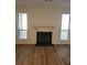 Living room with hardwood floors and a fireplace at 3982 Woodridge Way, Tucker, GA 30084