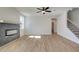 Living room features wood floors, fireplace, and a staircase at 3941 Adler Cir, Buford, GA 30519