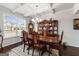 Well-lit dining room featuring a large table and cabinet at 916 Dexter Dr, Stockbridge, GA 30281