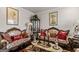 Living room with two ornate sofas and a coffee table at 916 Dexter Dr, Stockbridge, GA 30281