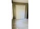 White bi-fold doors leading into a spacious closet at 130 Taunton Rd, Covington, GA 30014