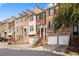 Brick townhomes with attached garages and front steps at 5317 Concordia Pl, Mableton, GA 30126