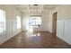 Bright dining room features hardwood floors, recessed lighting, and wainscoting at 1129 Red Oak Blvd, Loganville, GA 30052