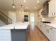 Spacious kitchen with island, white cabinets, and marble countertops at 1129 Red Oak Blvd, Loganville, GA 30052