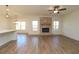 Spacious living room with hardwood floors and brick fireplace at 1129 Red Oak Blvd, Loganville, GA 30052