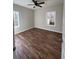 Bedroom features wood-look flooring, neutral walls, and natural light at 1250 Adamson Rd, Bowdon, GA 30108