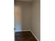 Walk in closet featuring laminate wood flooring and white trim at 1250 Adamson Rd, Bowdon, GA 30108