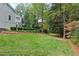 A shot of the lush backyard of this home featuring mature landscaping and an elegant hardscape at 2908 Mabry Ne Ln, Brookhaven, GA 30319