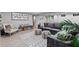 The basement has a large grey leather couch, a patterned area rug, and decor at 2908 Mabry Ne Ln, Brookhaven, GA 30319