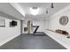 A finished basement with work out equipment including a treadmill and gymnastic rings at 2908 Mabry Ne Ln, Brookhaven, GA 30319