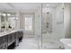 Bright and airy bathroom featuring a glass-enclosed shower, soaking tub, and double vanity for a spa-like experience at 2908 Mabry Ne Ln, Brookhaven, GA 30319