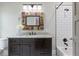 Bathroom featuring granite countertops, stylish mirror, and white subway tile in the bath and shower area at 2908 Mabry Ne Ln, Brookhaven, GA 30319