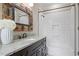 Bathroom with granite countertops, stylish mirror, and white subway tile in the bath and shower area at 2908 Mabry Ne Ln, Brookhaven, GA 30319