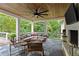 Relax in this outdoor covered porch that features a fireplace and a ceiling fan at 2908 Mabry Ne Ln, Brookhaven, GA 30319