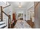Grand foyer with dark wood floors, a staircase with white risers, and views into the living spaces at 2908 Mabry Ne Ln, Brookhaven, GA 30319