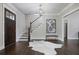 Stylish foyer with hardwood floors, a staircase, and a dark wood front door at 2908 Mabry Ne Ln, Brookhaven, GA 30319